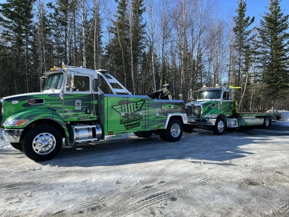 Elite Towing carrier truck performing recovery (Real Photo)
